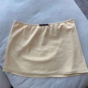 Yellow satin mini skirt